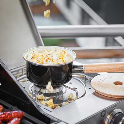 The popcorn pan on the side burner
