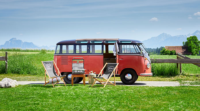 Red VW Bully with deckchairs and Videro G2-P