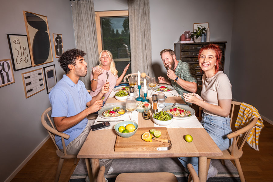 Spare parts search Friends sit together at the table and eat together