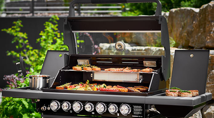 Meat and vegetables on the gas grill BBQ Station Magnum