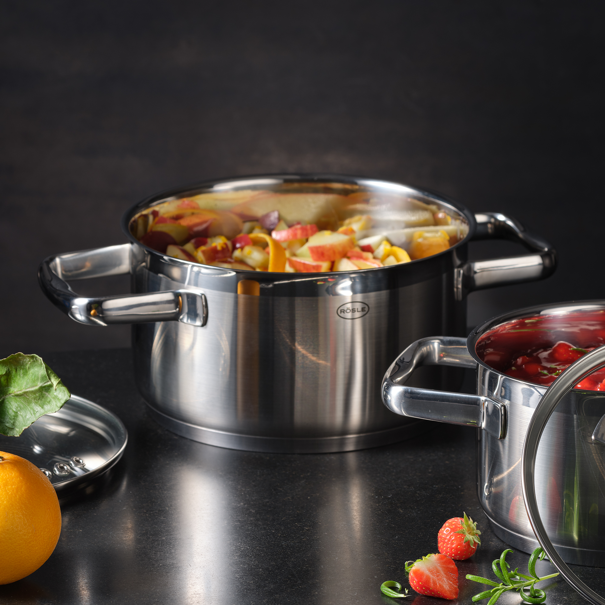 Cooking pot, 20 cm, made of stainless steel, filled with fruit and vegetables, two handles, shiny surface