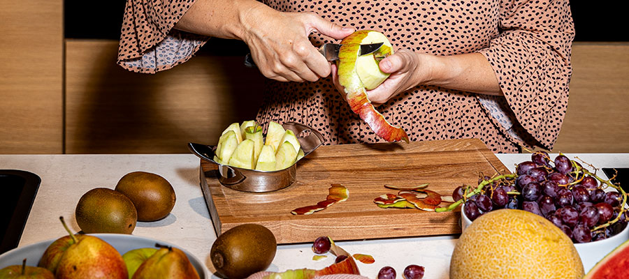 Knives Woman peeling an apple with a paring knife