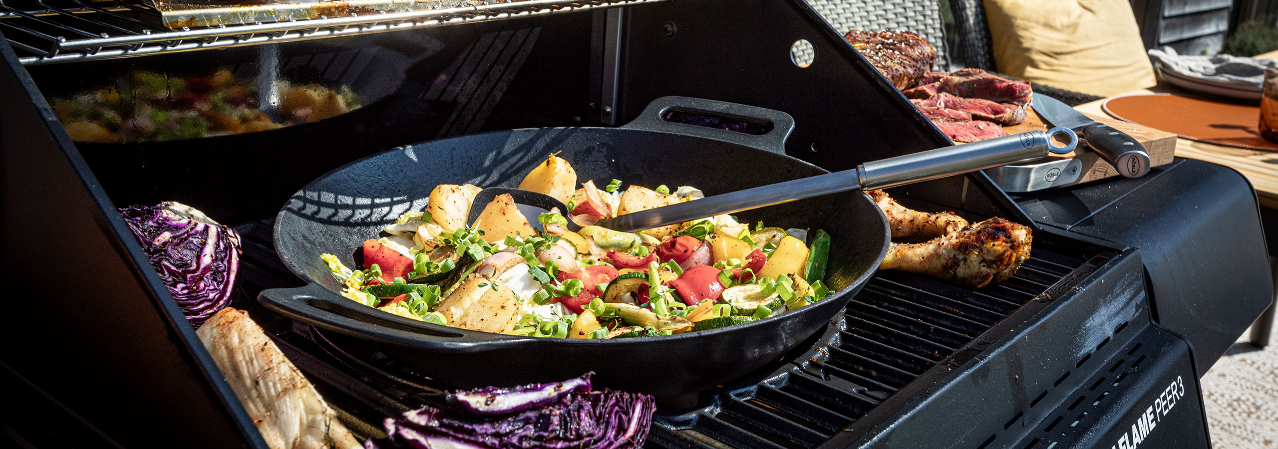 Wok Grilling wok vegetables in a wok on a grill