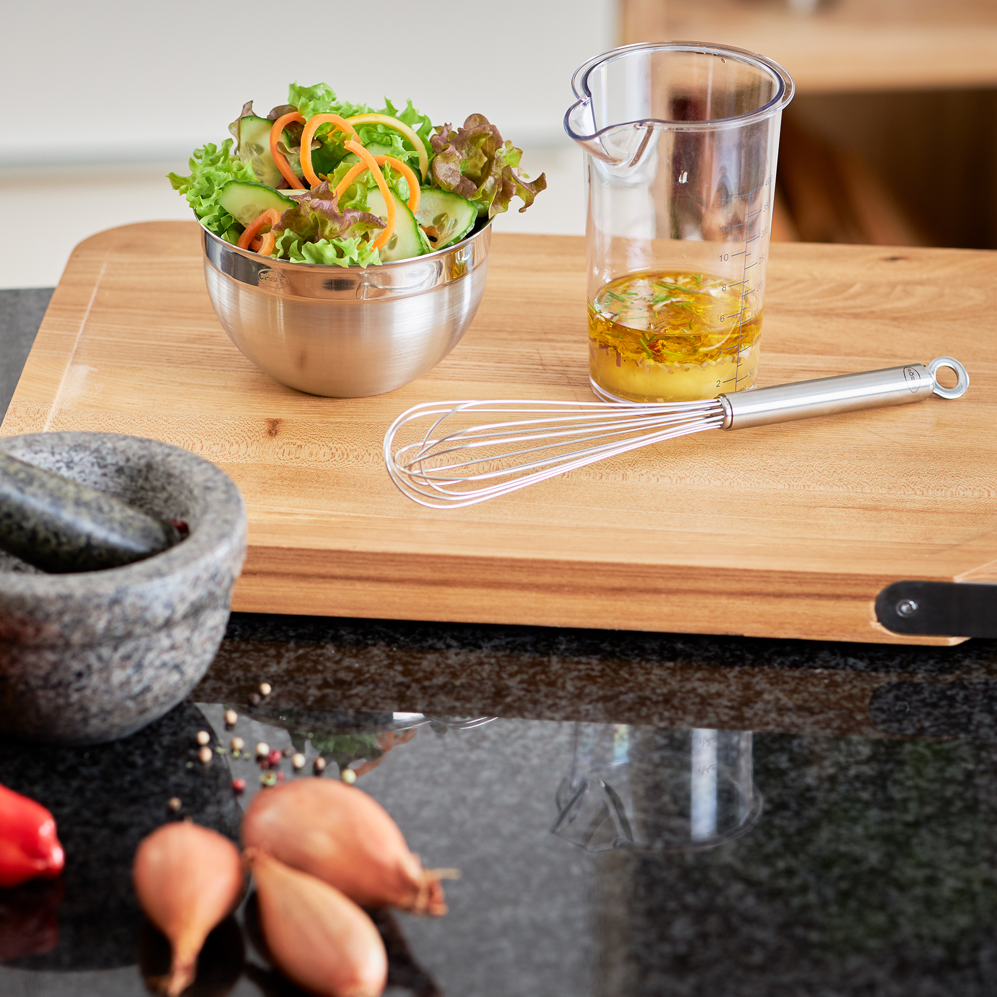 RÖSLE mug whisk on kitchen worktop Stainless steel mug whisk, 27 cm, on a kitchen worktop with a bowl of salad and a measuring...