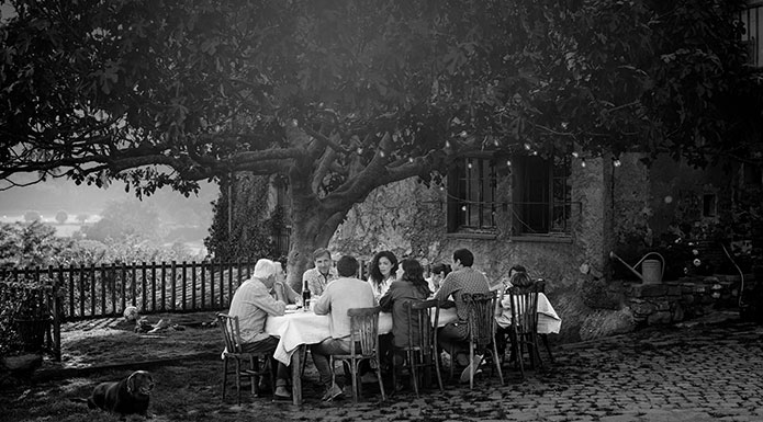 Family at the dining table outside