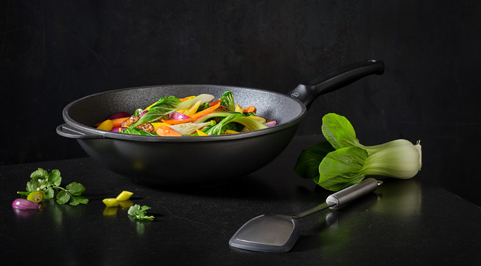 Wok vegetables in the Cadini wok pan next to the pan/wok spoon Silicone