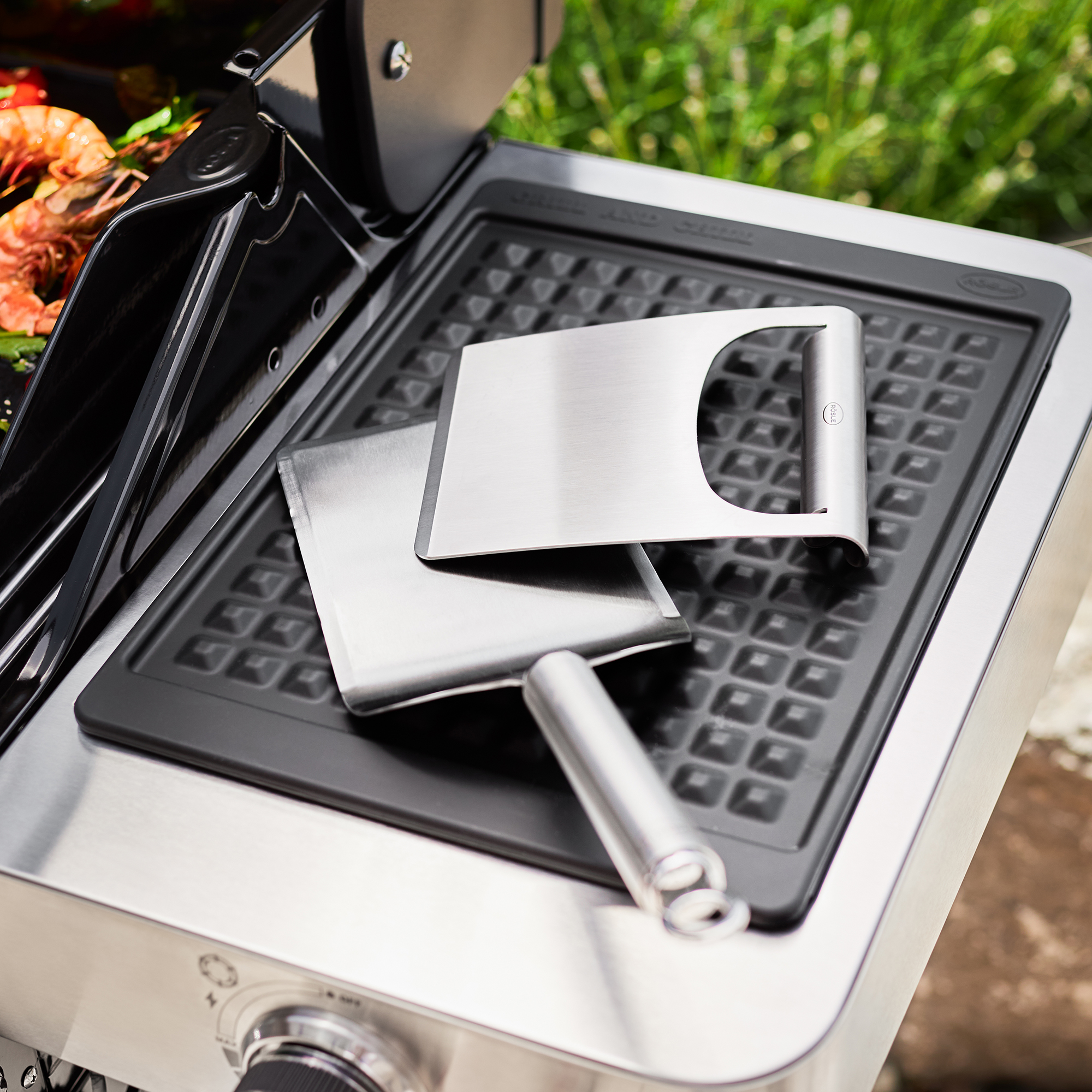 RÖSLE wide stainless steel plancha spatula Plancha spatula, wide stainless steel spatula on a grill plate, with another spatula next...