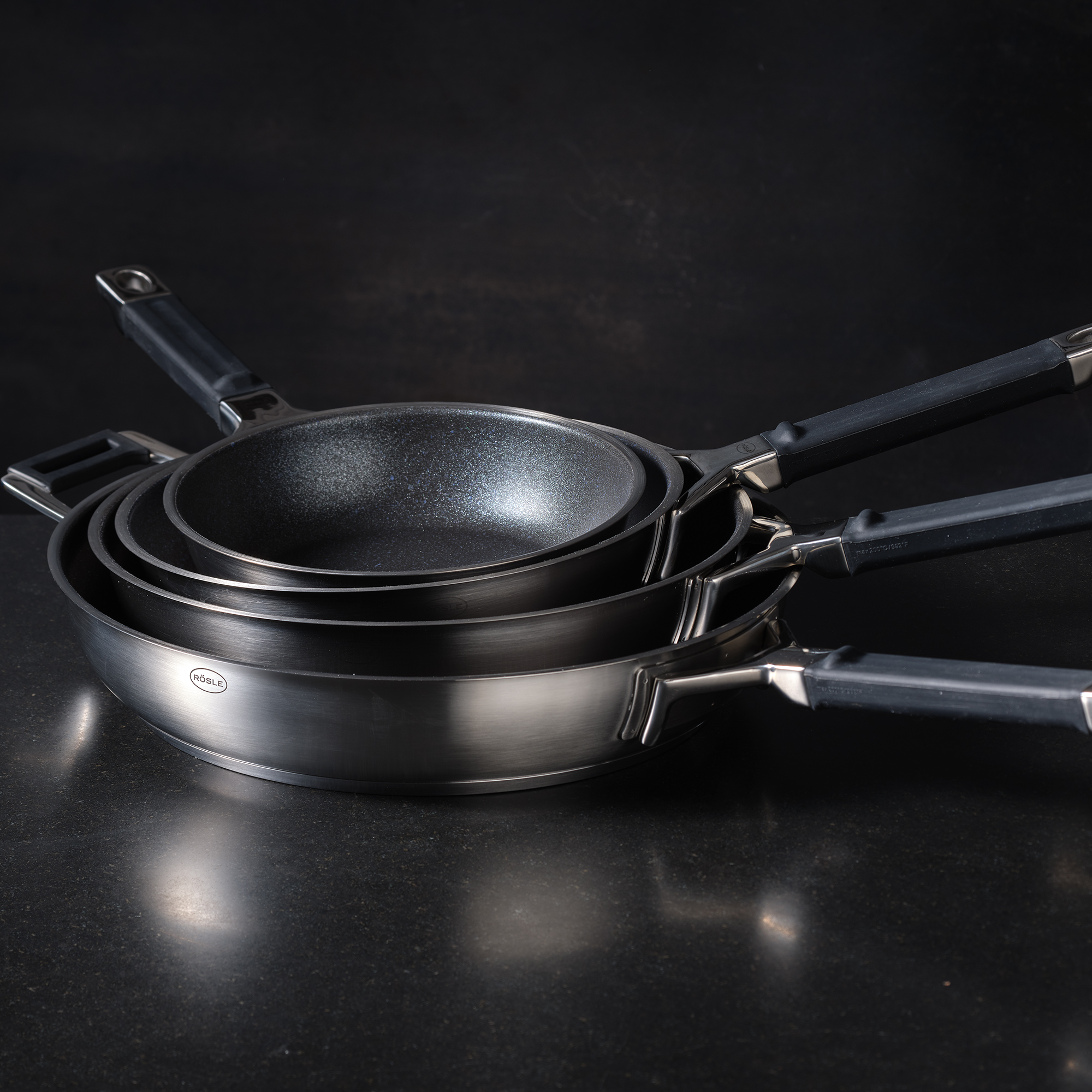 Stack of RÖSLE frying pans Stack of frying pans, black, made of ProResist material, with ergonomic handles