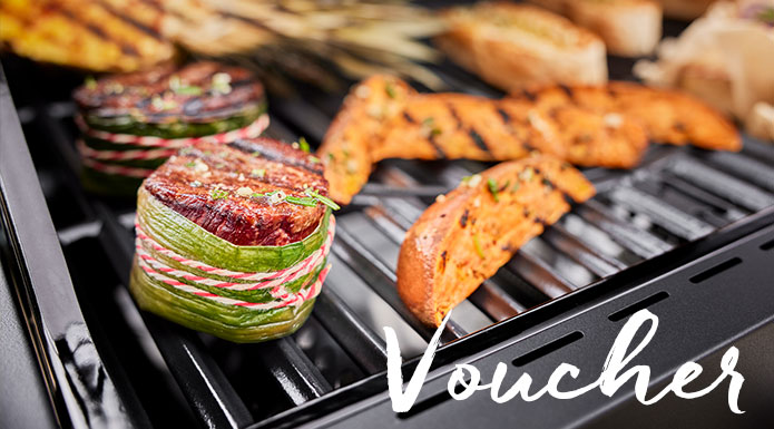 Barbecue food on the grill with the writing voucher