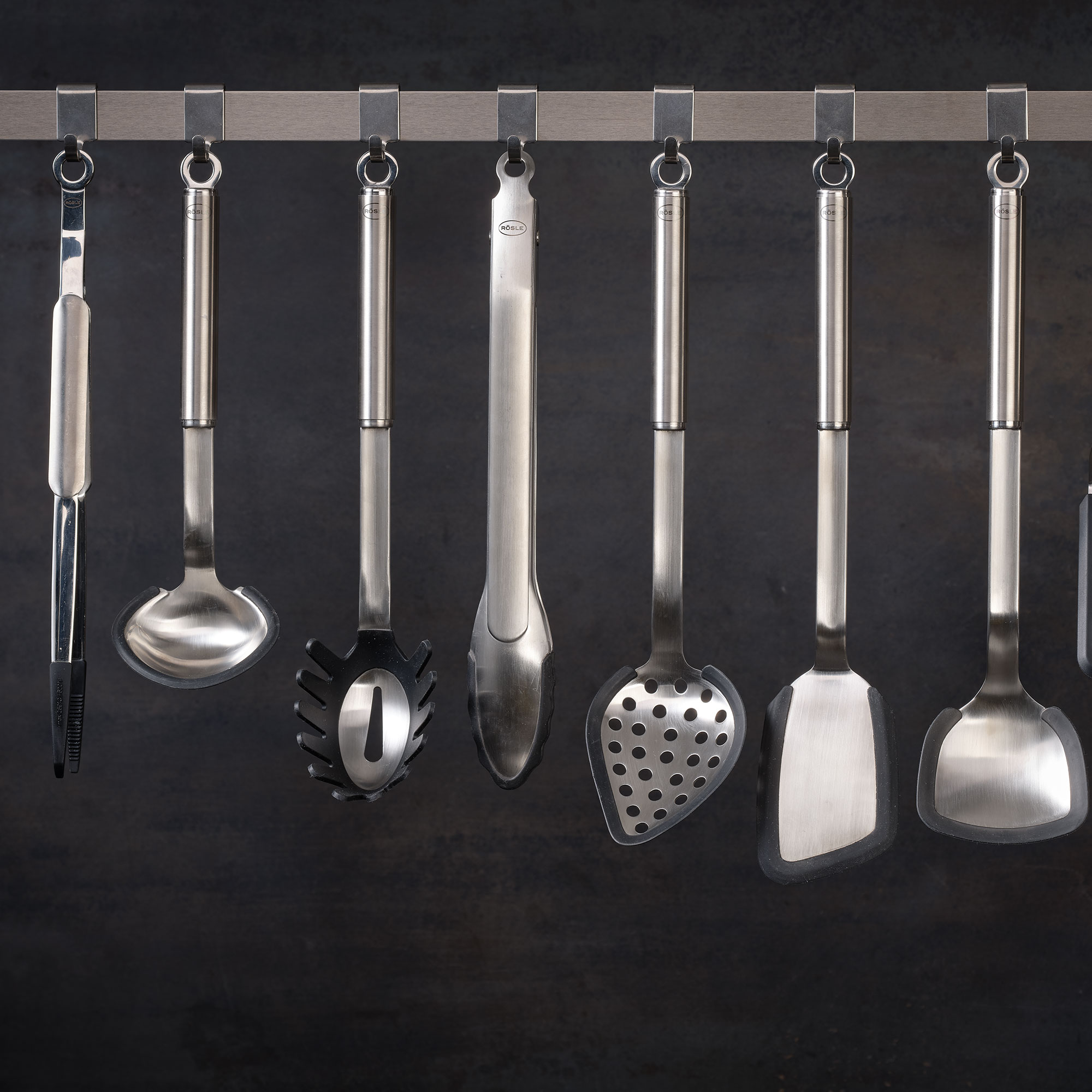 RÖSLE gourmet tongs made from silicone Gourmet silicone tongs, 30 cm, on a hanging bar with other kitchen utensils.