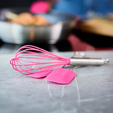 whisk and scarper pink charity Whisk and Dough Scraper Pink Charity on a Table
