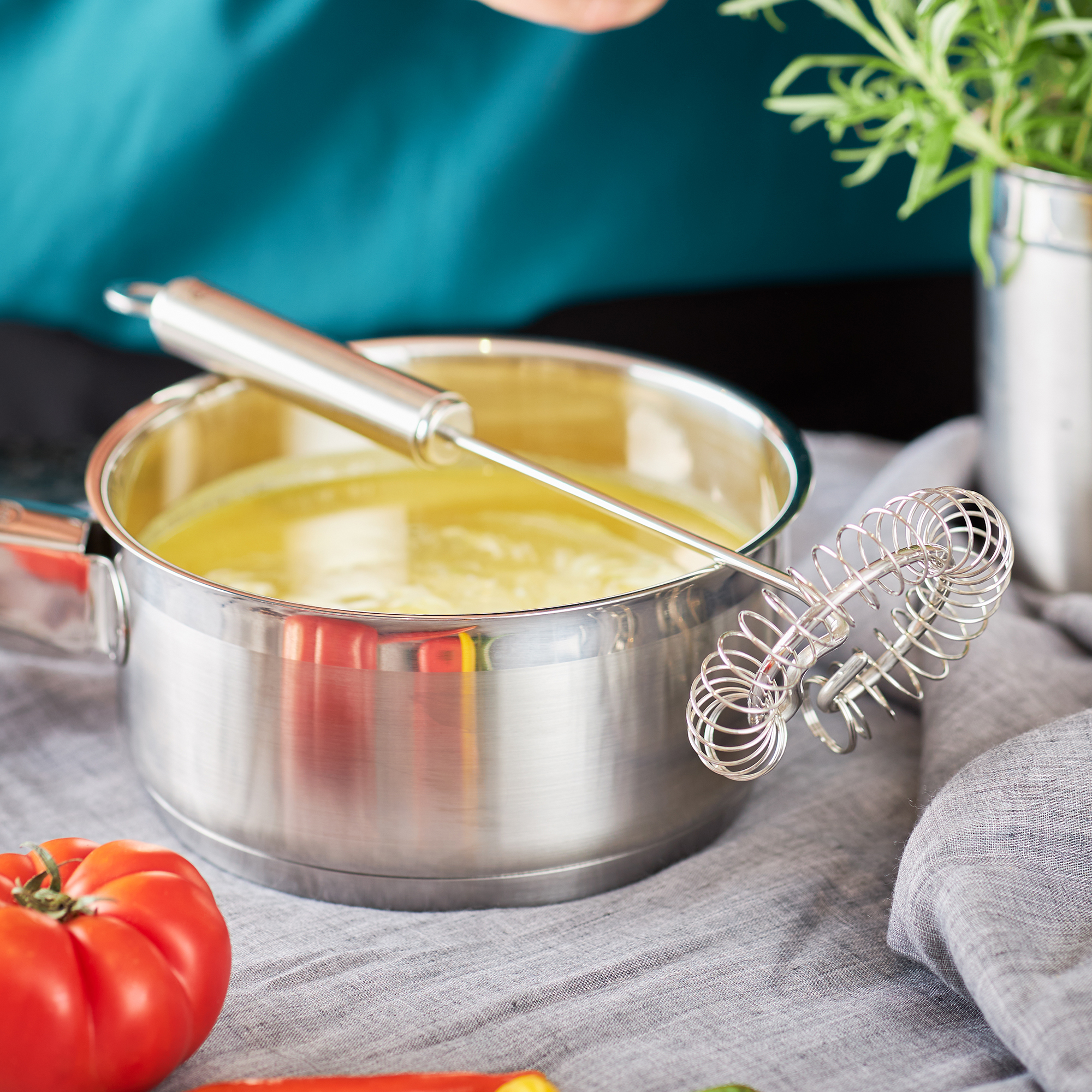RÖSLE spiral whisk in a pot Stainless steel spiral whisk, 22 cm, in a pot with yellow liquid, with fresh vegetables next...
