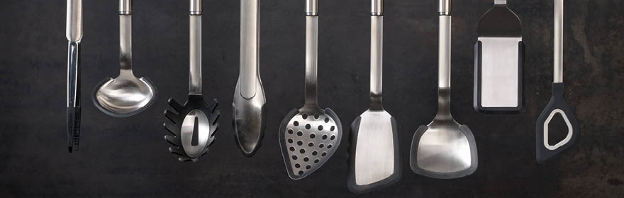 Kitchen tools Stainless steel kitchen utensils, including spoon, scoop and spatula.